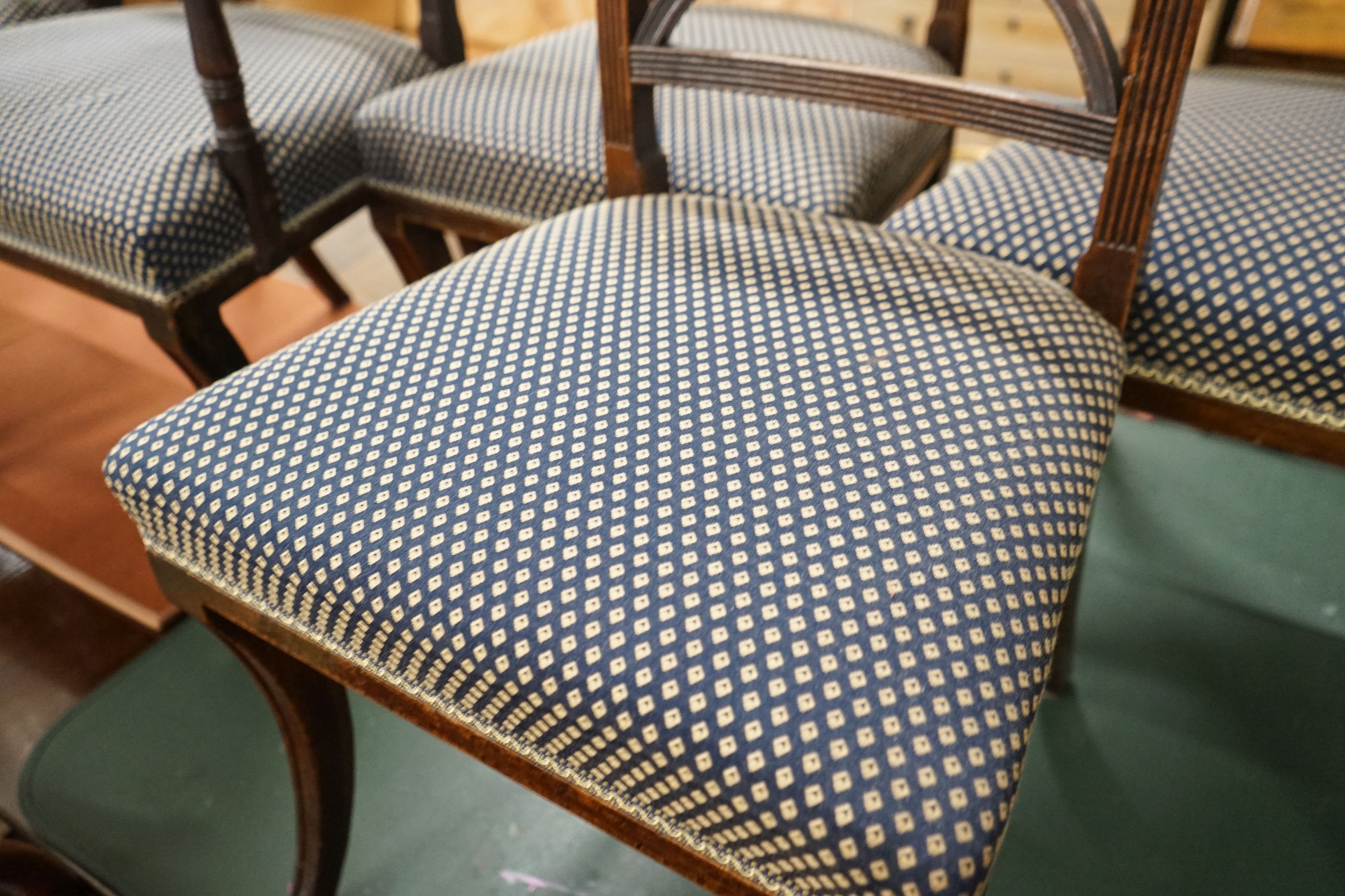 A set of five Regency mahogany dining chairs, (one with arms, four single)